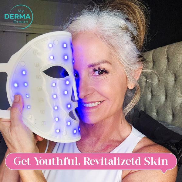 Get Youthful, Revitalized Skin; A woman is holding a LED face mask with blue light, covering half of her face
